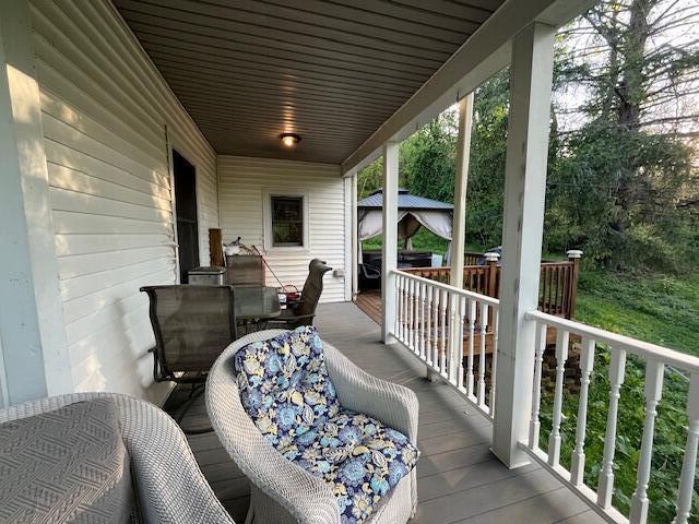 deck with outdoor dining area
