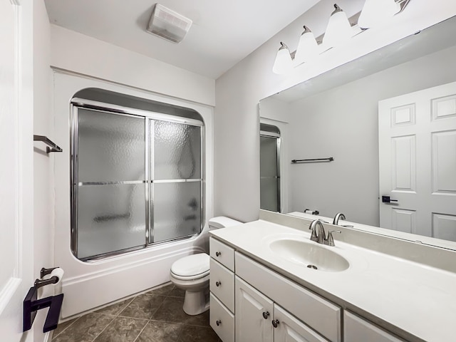 full bathroom with vanity, toilet, shower / bath combination with glass door, and visible vents