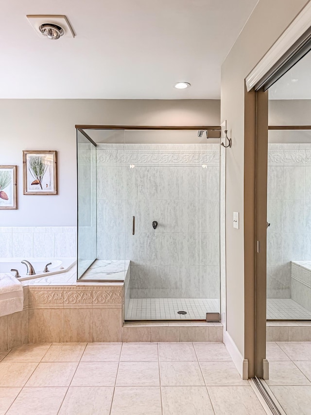 full bath with tile patterned floors, visible vents, a shower stall, and a bath