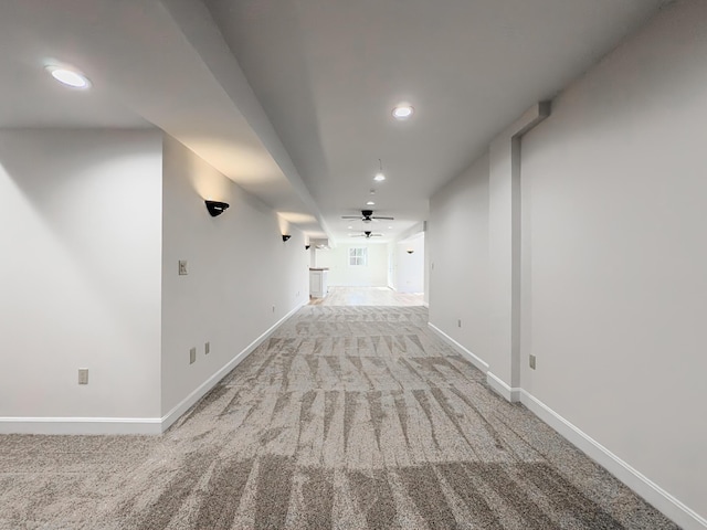 hall with recessed lighting, baseboards, and carpet
