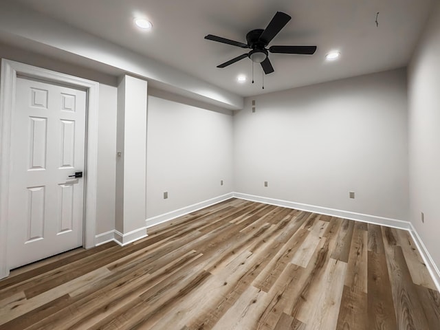 interior space with recessed lighting, baseboards, and wood finished floors