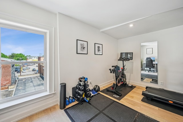 workout area with wood finished floors, baseboards, and recessed lighting