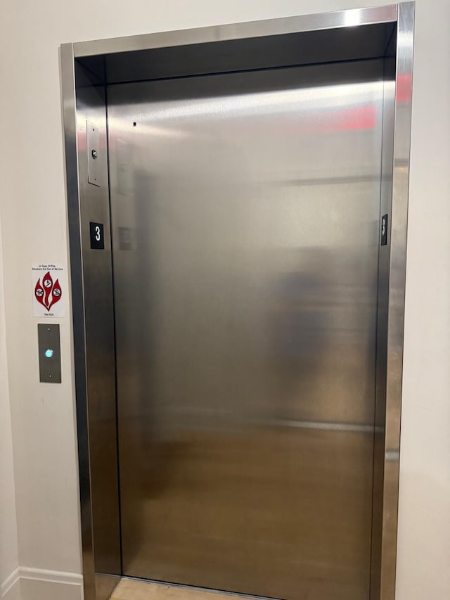 elevator featuring baseboards