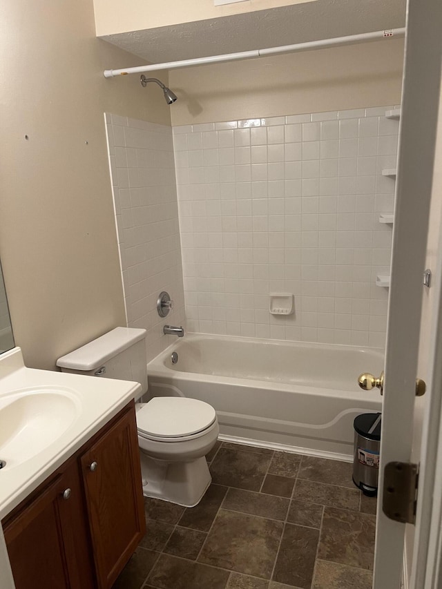 bathroom featuring toilet, shower / bathing tub combination, and vanity