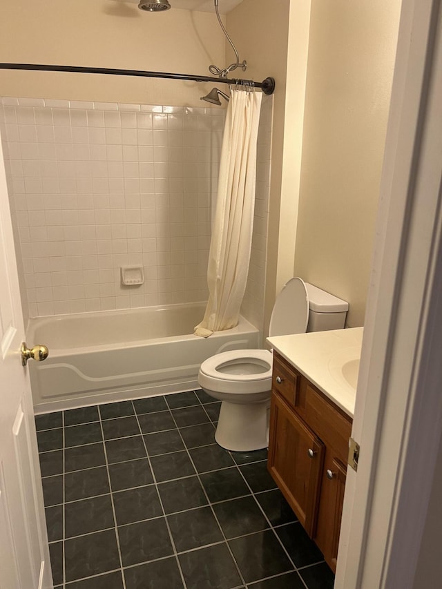 full bathroom featuring tile patterned floors, shower / bathtub combination with curtain, vanity, and toilet