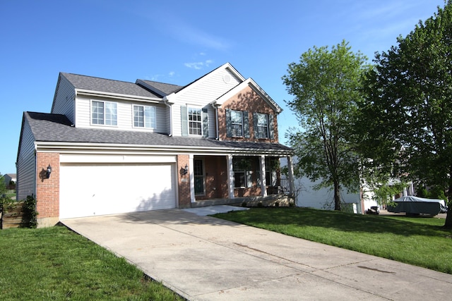 traditional-style home featuring brick siding, a front lawn, driveway, and covered porch