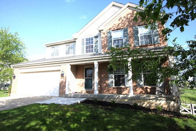 traditional-style house with concrete driveway, brick siding, a porch, and a front lawn