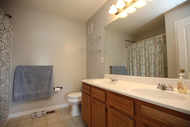 bathroom with visible vents, a sink, tile patterned floors, and toilet