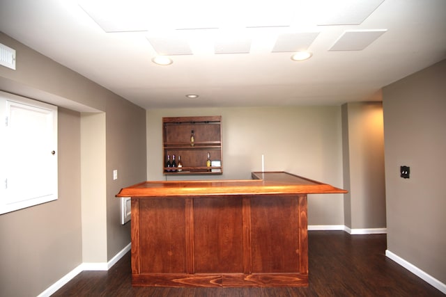 bar with recessed lighting, baseboards, a dry bar, and dark wood finished floors