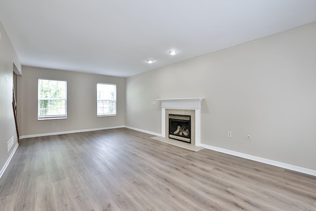 1609 Woodfield Ct, Hebron, KY 41048 - unfurnished living room with a fireplace and light wood finished floors
