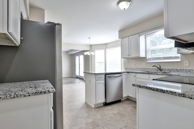 1609 Woodfield Ct, Hebron, KY 41048 - kitchen with stainless steel appliances, white cabinetry, a peninsula, and light stone countertops