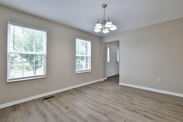 1609 Woodfield Ct, Hebron, KY 41048 - empty room with a chandelier and wood finished floors