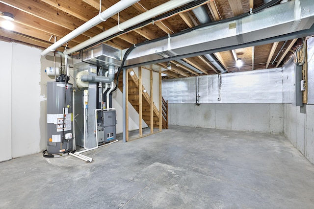 1609 Woodfield Ct, Hebron, KY 41048 - unfinished below grade area with gas water heater, heating unit, and stairway