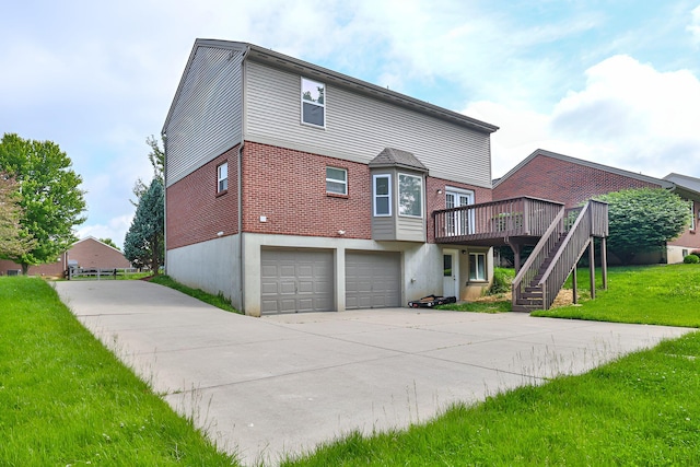 1609 Woodfield Ct, Hebron, KY 41048 - back of property with stairs, driveway, a wooden deck, and an attached garage