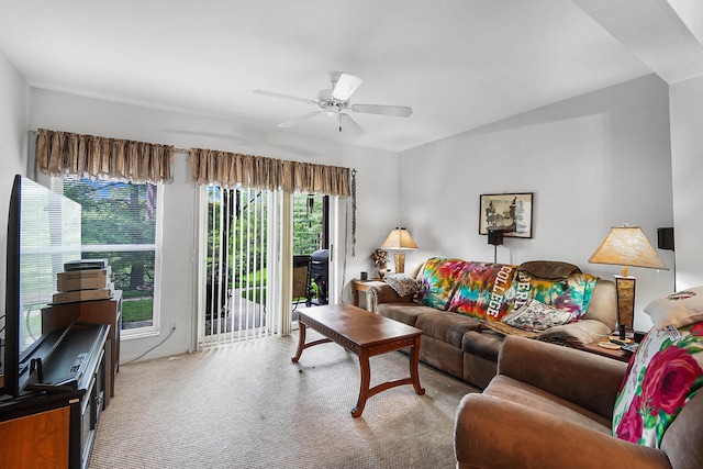 living room featuring light colored carpet and ceiling fan