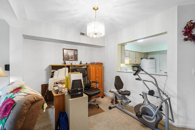 workout room featuring carpet floors, a chandelier, and baseboards