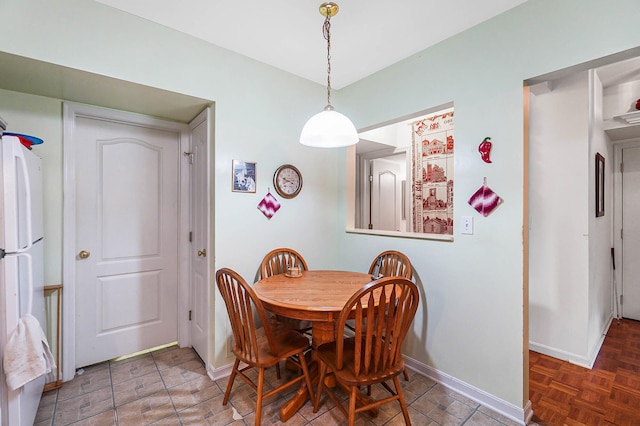 dining space with baseboards