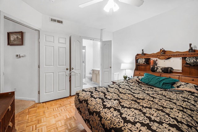 bedroom featuring ensuite bath and a ceiling fan