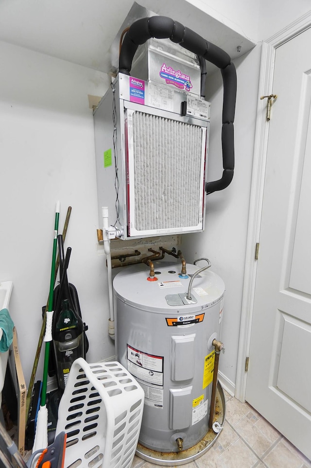 utility room featuring electric water heater