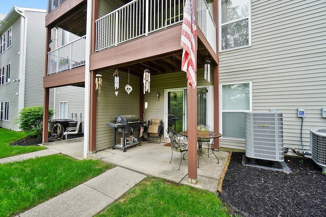 view of patio / terrace featuring a grill and cooling unit