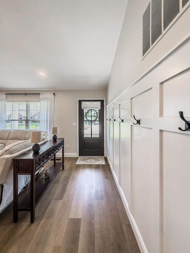 foyer entrance with recessed lighting, baseboards, dark wood finished floors, and visible vents