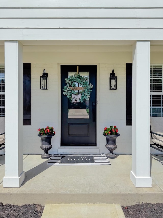 entrance to property with covered porch