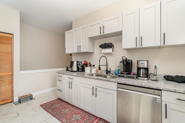 kitchen featuring light stone countertops, a sink, dishwasher, marble finish floor, and white cabinetry