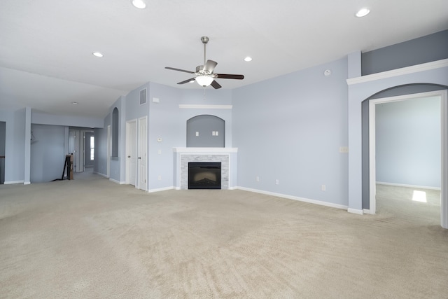 unfurnished living room featuring carpet flooring, recessed lighting, ceiling fan, and a fireplace