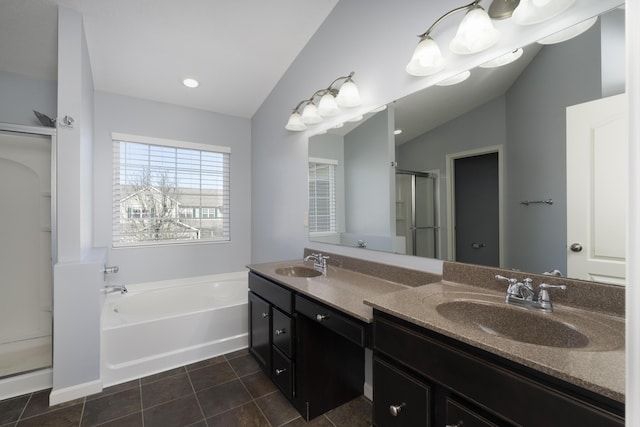 bathroom with a sink, tile patterned floors, a stall shower, and a garden tub