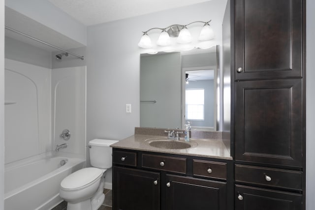 bathroom with vanity, a ceiling fan, toilet, and  shower combination