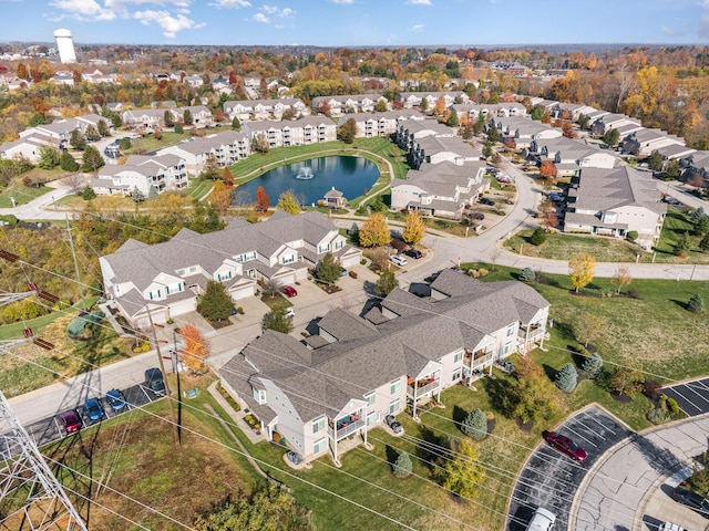 drone / aerial view with a residential view and a water view