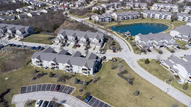 aerial view with a water view and a residential view