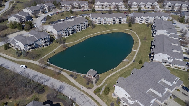 drone / aerial view featuring a water view and a residential view