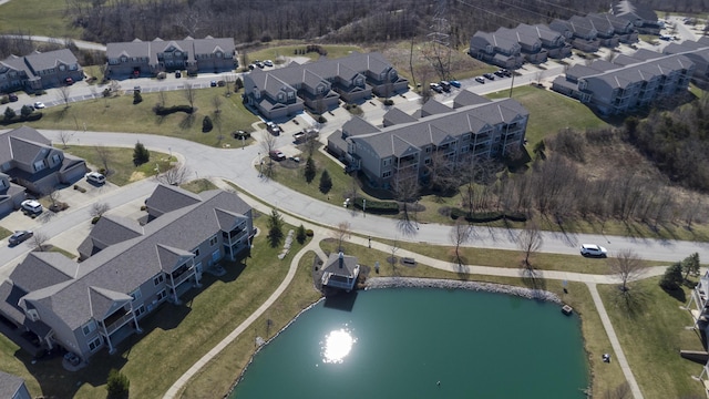 bird's eye view featuring a water view and a residential view