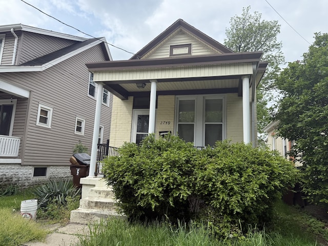 2749 Alexandria Ave, Covington, KY 41015 - shotgun-style home with a porch