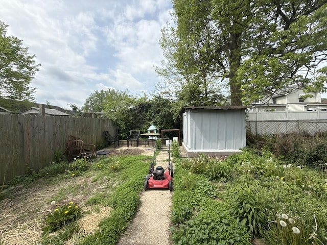 2749 Alexandria Ave, Covington, KY 41015 - view of yard with a storage unit, a fenced backyard, and an outdoor structure