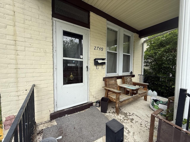 2749 Alexandria Ave, Covington, KY 41015 - doorway to property with brick siding and covered porch