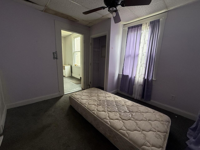 2749 Alexandria Ave, Covington, KY 41015 - carpeted bedroom featuring baseboards, ceiling fan, a paneled ceiling, and ensuite bathroom