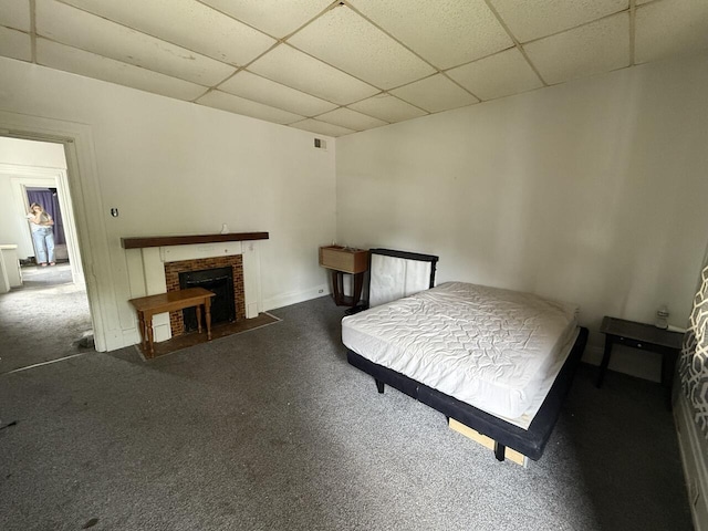 2749 Alexandria Ave, Covington, KY 41015 - carpeted bedroom with visible vents, a paneled ceiling, and a fireplace