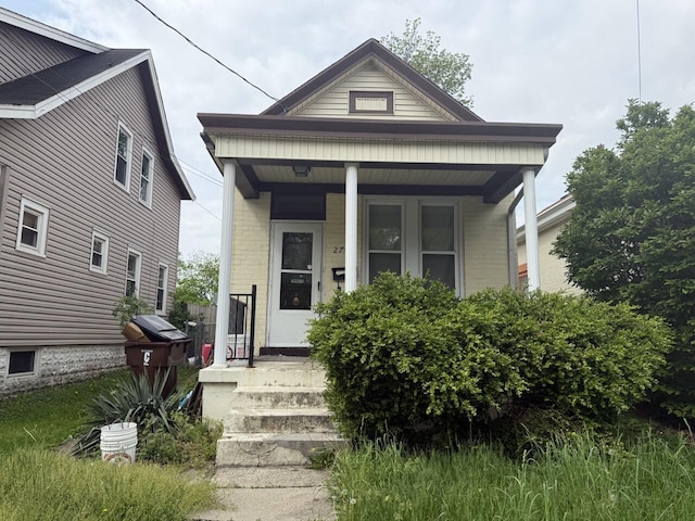 2749 Alexandria Ave, Covington, KY 41015 - shotgun-style home with covered porch and brick siding