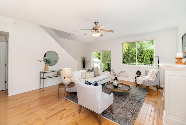 living area featuring ceiling fan and light wood-style floors