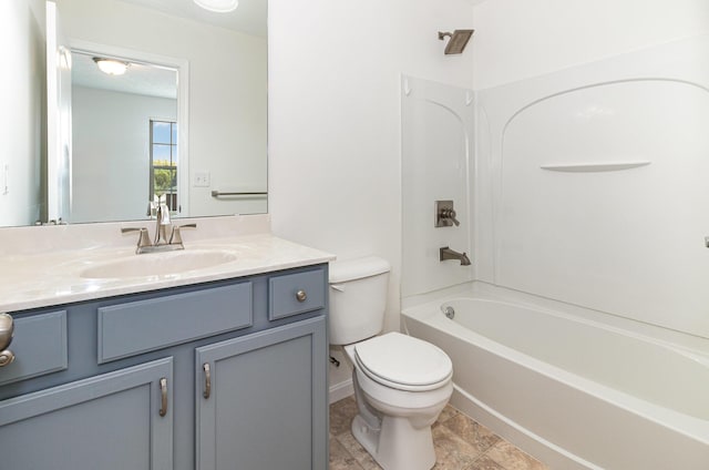 bathroom with vanity, toilet, and shower / tub combination