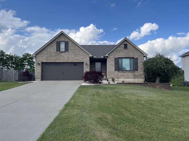 view of front facade featuring brick siding, fence, a front yard, and concrete driveway