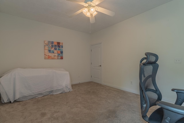 carpeted bedroom featuring a ceiling fan and baseboards