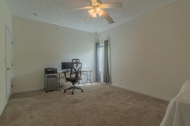 office area featuring carpet flooring, baseboards, and ceiling fan