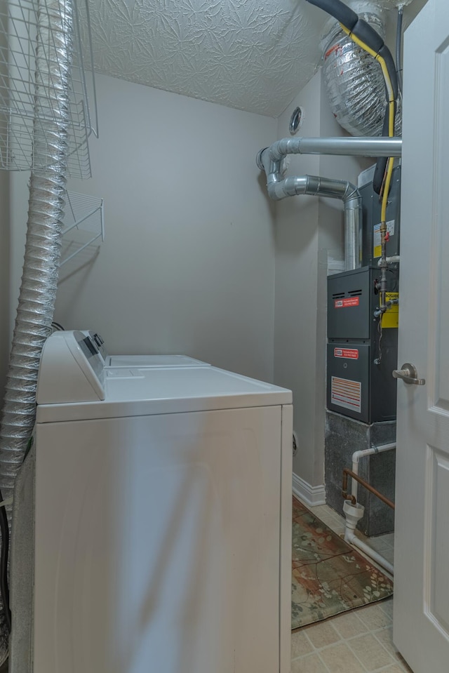 laundry room with washer and dryer