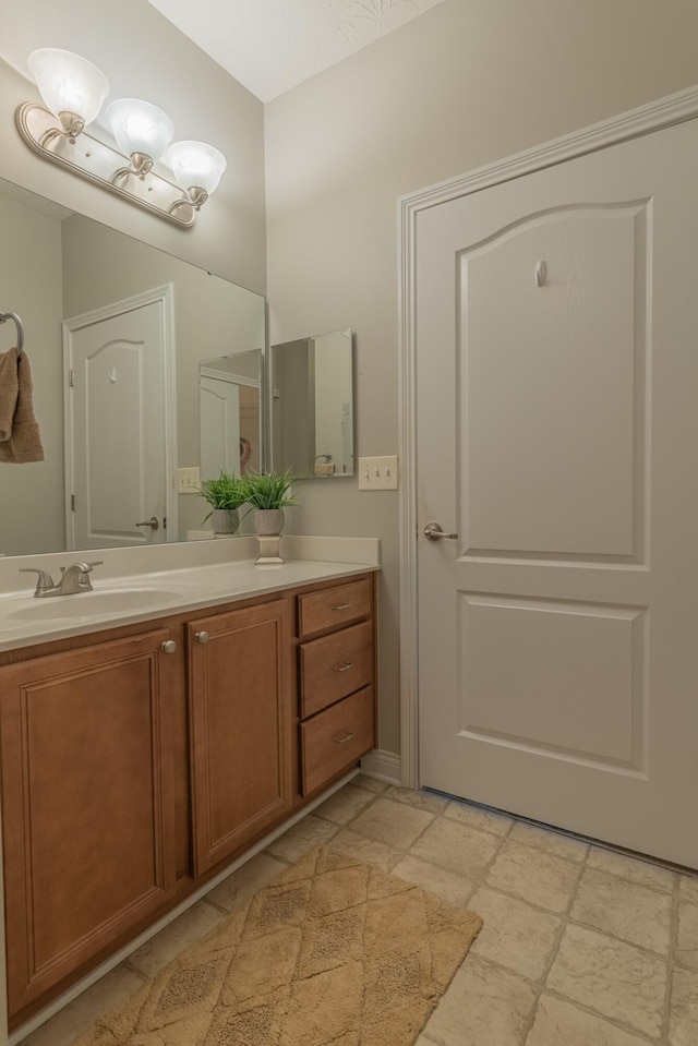 bathroom featuring vanity and stone tile floors