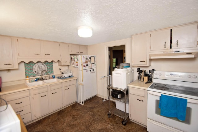 kitchen with a sink, under cabinet range hood, white appliances, and cream cabinetry