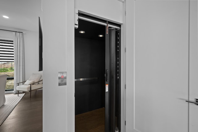 hall featuring recessed lighting and wood finished floors