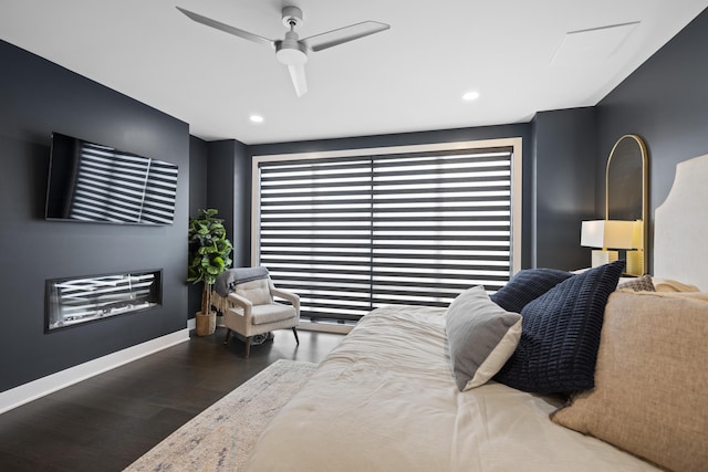 bedroom with baseboards, ceiling fan, recessed lighting, and wood finished floors